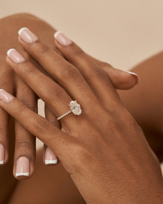 18 Karat Celine Elongated Oval Engagement Ring with Moissanite Center Stone and Diamond Accented Shank